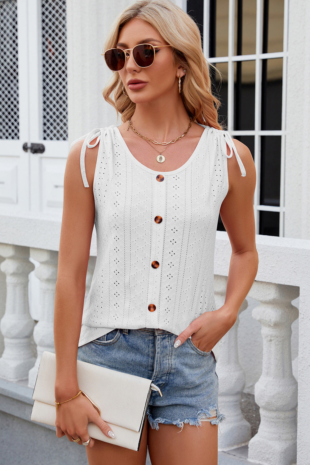 Discover elegance with our Eyelet Tank! A round neck, wide straps, and breathable fabric offer style and comfort for any occasion. Shop now!