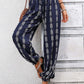 Navy boho chic drawstring pants with intricate pattern