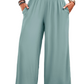 Discover elegant comfort with our Smocked Wide Leg Pants, featuring a flexible waist, chic design, and practical pockets for everyday style.