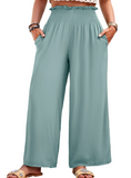 Discover elegant comfort with our Smocked Wide Leg Pants, featuring a flexible waist, chic design, and practical pockets for everyday style.