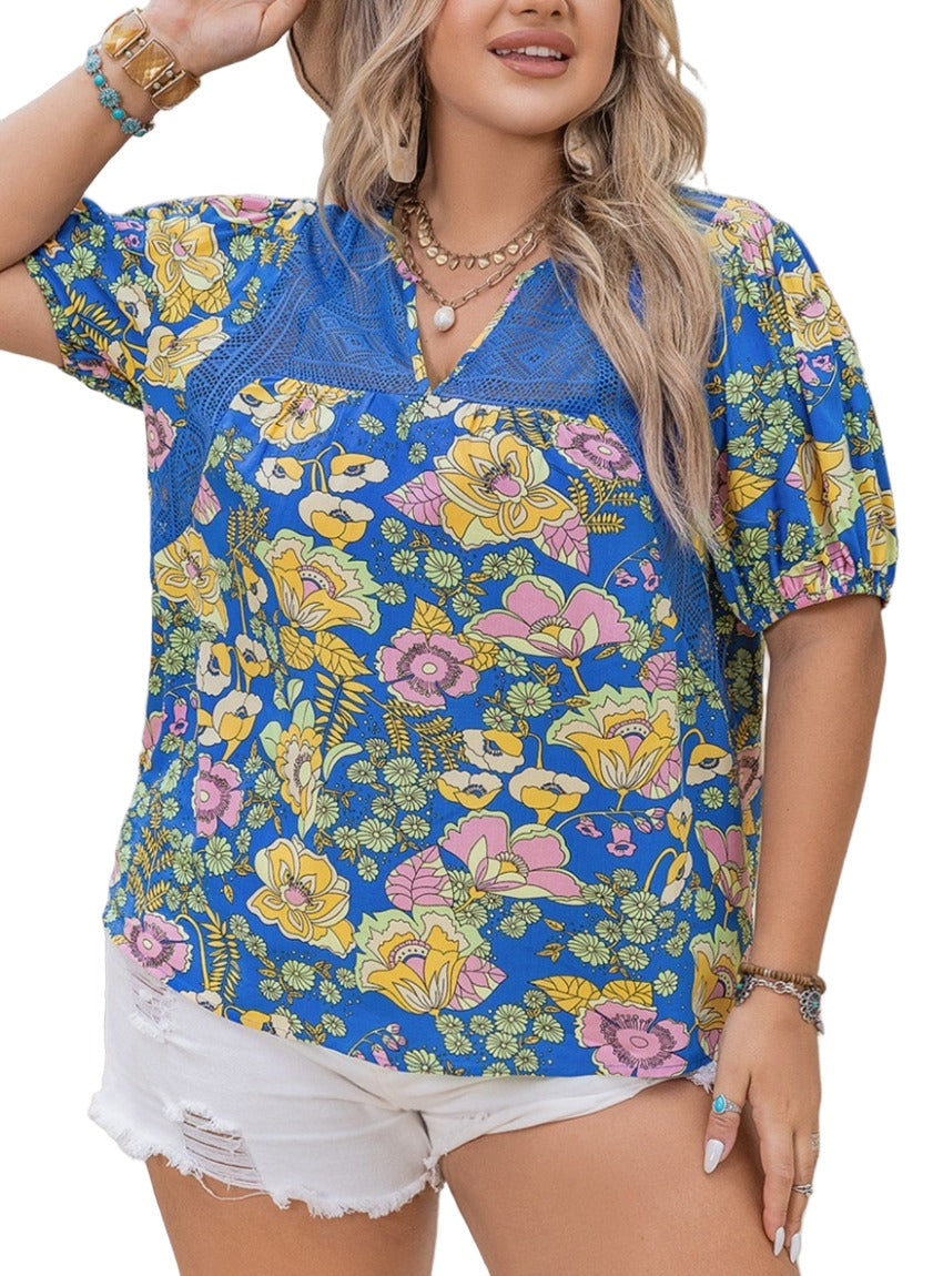 Bright floral print blouse with blue, yellow, and pink flowers