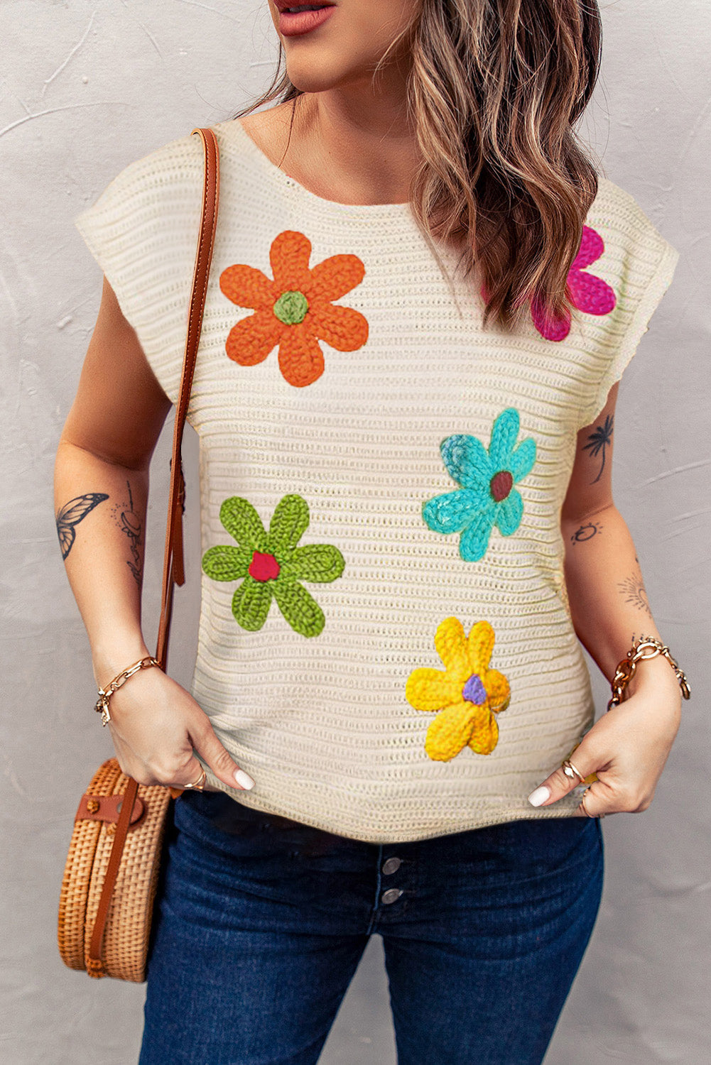 Embrace spring with our Flower Knit Top—perfect for adding a touch of floral charm and comfort to your everyday style