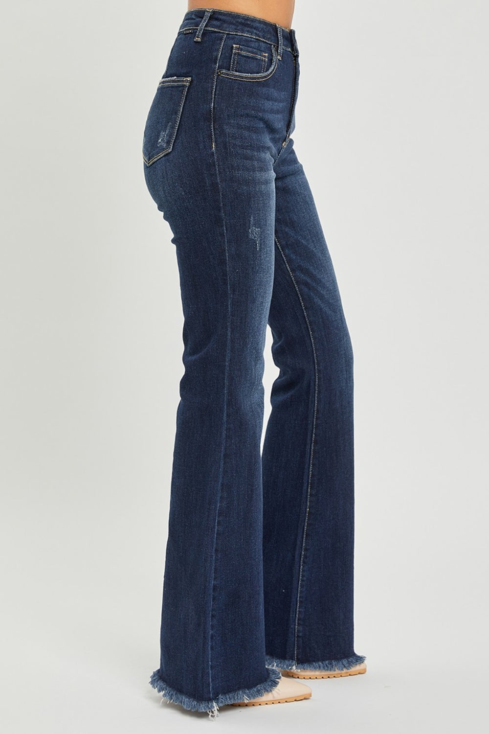 Elevate your style with RISEN's High Waist Flare Jeans featuring a trendy raw hem. Perfect blend of retro charm and modern fit for any occasion.