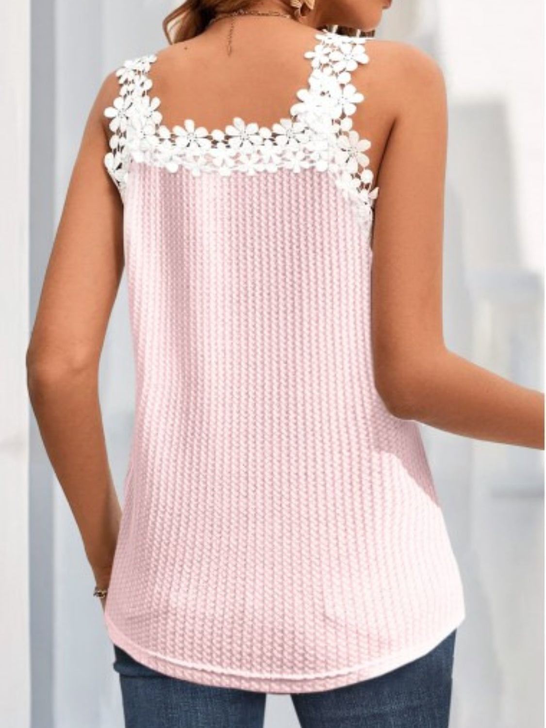 Feminine pink sleeveless shirt with lace details