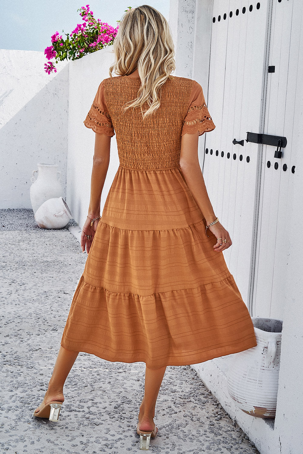 Discover elegance with our Smocked Midi Dress, perfect for any occasion. Comfort meets style in five beautiful colors.