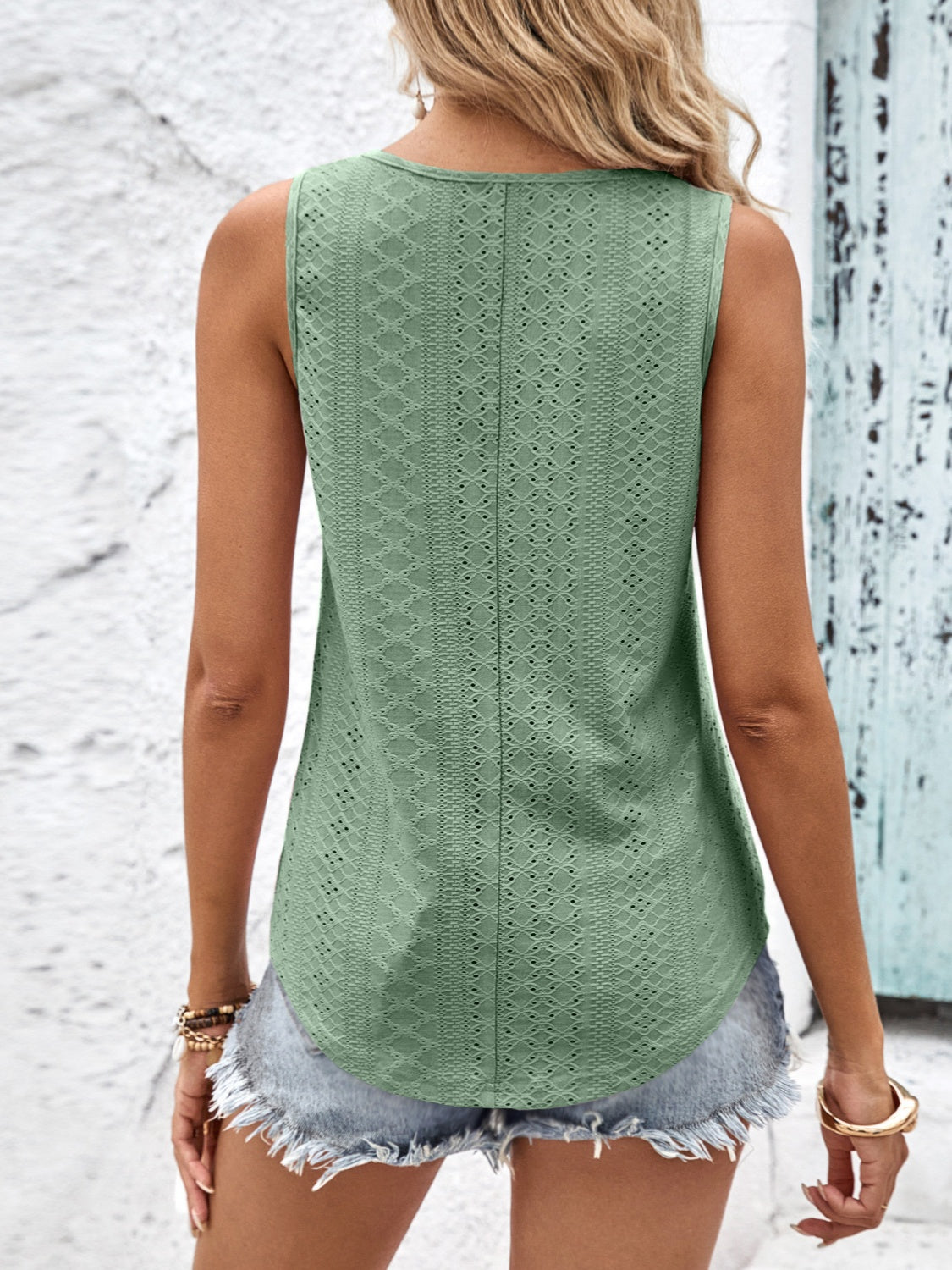 Elevate your style with our Eyelet Wide Strap Tank, available in mauve, black, white, and sage. Perfect for any occasion!