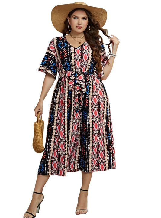 Vibrant patterned plus-size midi dress with tie-waist detail