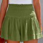Shop versatile Smocked Waistband Shorts in black, moss, or blue. Perfect blend of style & comfort for any casual occasion.