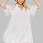 Boho tiered dress in white with ruffled sleeves and a V-neckline.