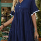 Chic navy blue dress with white ruffled trim for summer