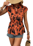 Chic orange floral tie-neck blouse with cap sleeves & a cinched waist, perfect for a summer look that's both stylish and comfortable