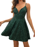 Dazzle in our Sequin Spaghetti Strap Dress! Flattering silhouette, shimmering sequins, perfect for any occasion. Available in green and camel.