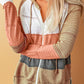 Casual knit hoodie with earthy stripes and zip-up front for a comfortable, relaxed style