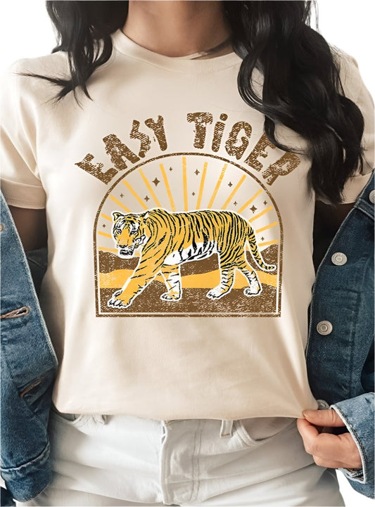 Woman wearing a beige "Easy Tiger" graphic tee with a relaxed, vintage-inspired design.