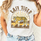 Woman showcasing her effortless style in a white "Easy Tiger" graphic t-shirt.