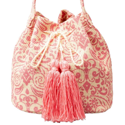 Vibrant pink and cream patterned bucket bag with tassels.