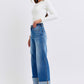 Relaxed wide-leg jeans with functional pockets and distressed accents
