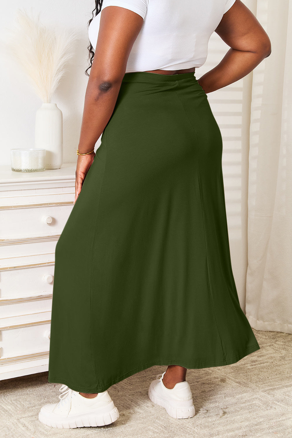 Comfortable olive maxi skirt featuring an adjustable drawstring waist.