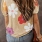 Vibrant short sleeve blouse with colorful floral print, perfect for adding a cheerful touch to any casual or semi-casual outfit.