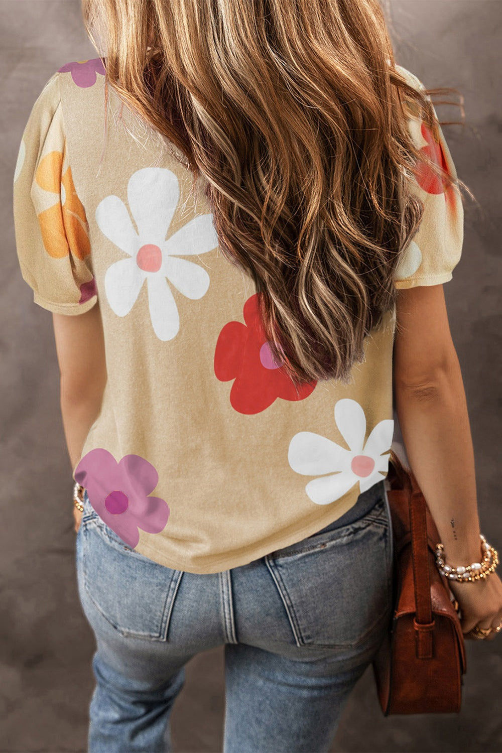 Vibrant short sleeve blouse with colorful floral print, perfect for adding a cheerful touch to any casual or semi-casual outfit.