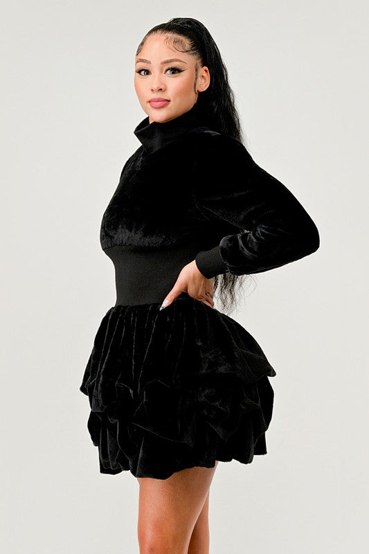 Elegant black dress with a mock neck and ruffled detailing, ideal for evening wear.
