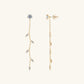 Elegant gold leaf earrings with moissanite stones
