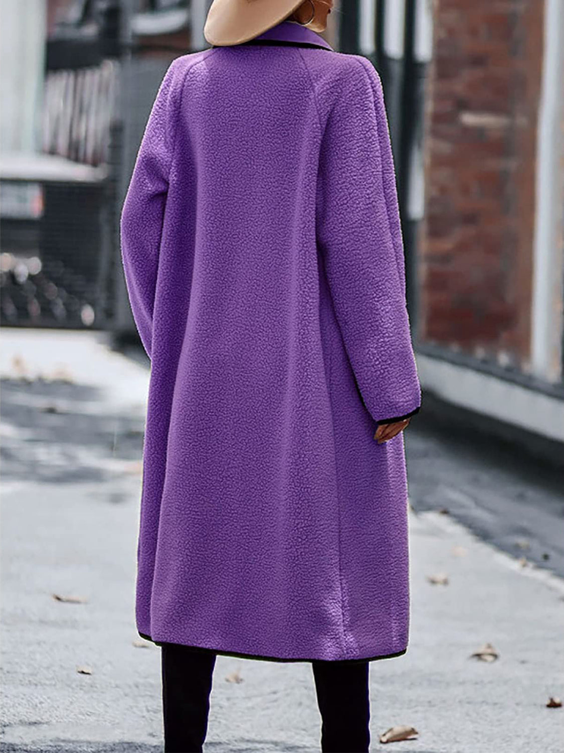 Women's elegant long purple sherpa coat, perfect for winter styling.
