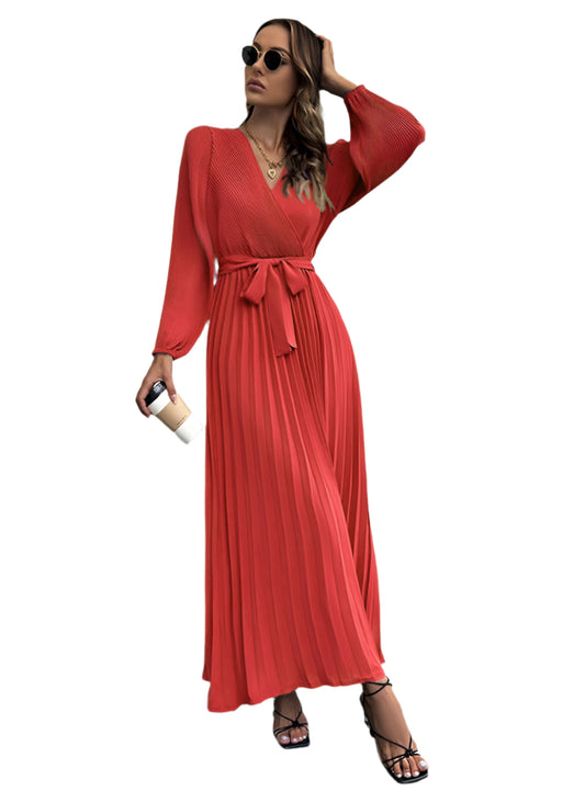 Flattering red midi dress featuring a V-neckline and waist tie detail.
