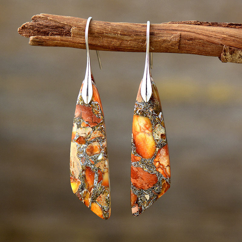 Elegant tangerine earrings featuring unique stone patterns and copper finish