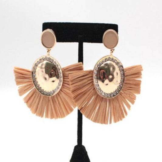 Elegant tassel earrings with a shimmering central disc and delicate neutral-colored tassels, perfect for adding a touch of sophistication to any outfit.