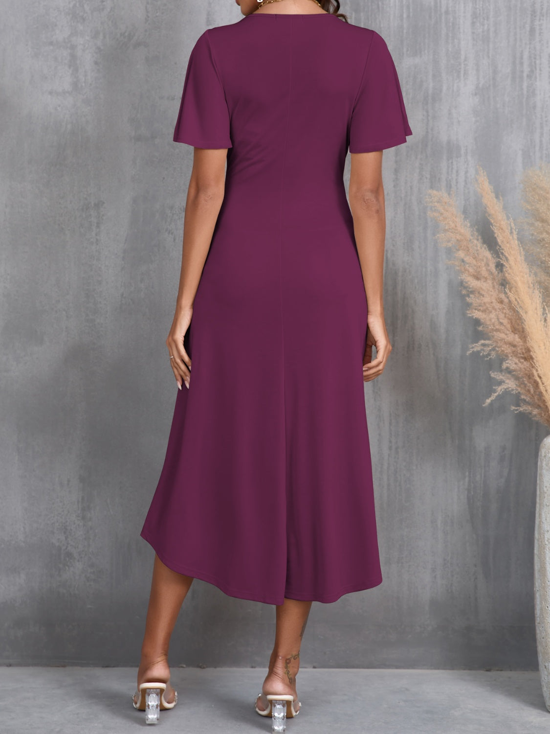 Women's midi dress in wine with soft flutter sleeves.
