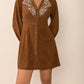 Caramel mini dress with button-down front and embroidered accents
