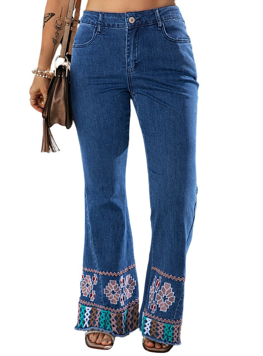 Front view of embroidered bootcut jeans showcasing intricate embroidery along the hem.