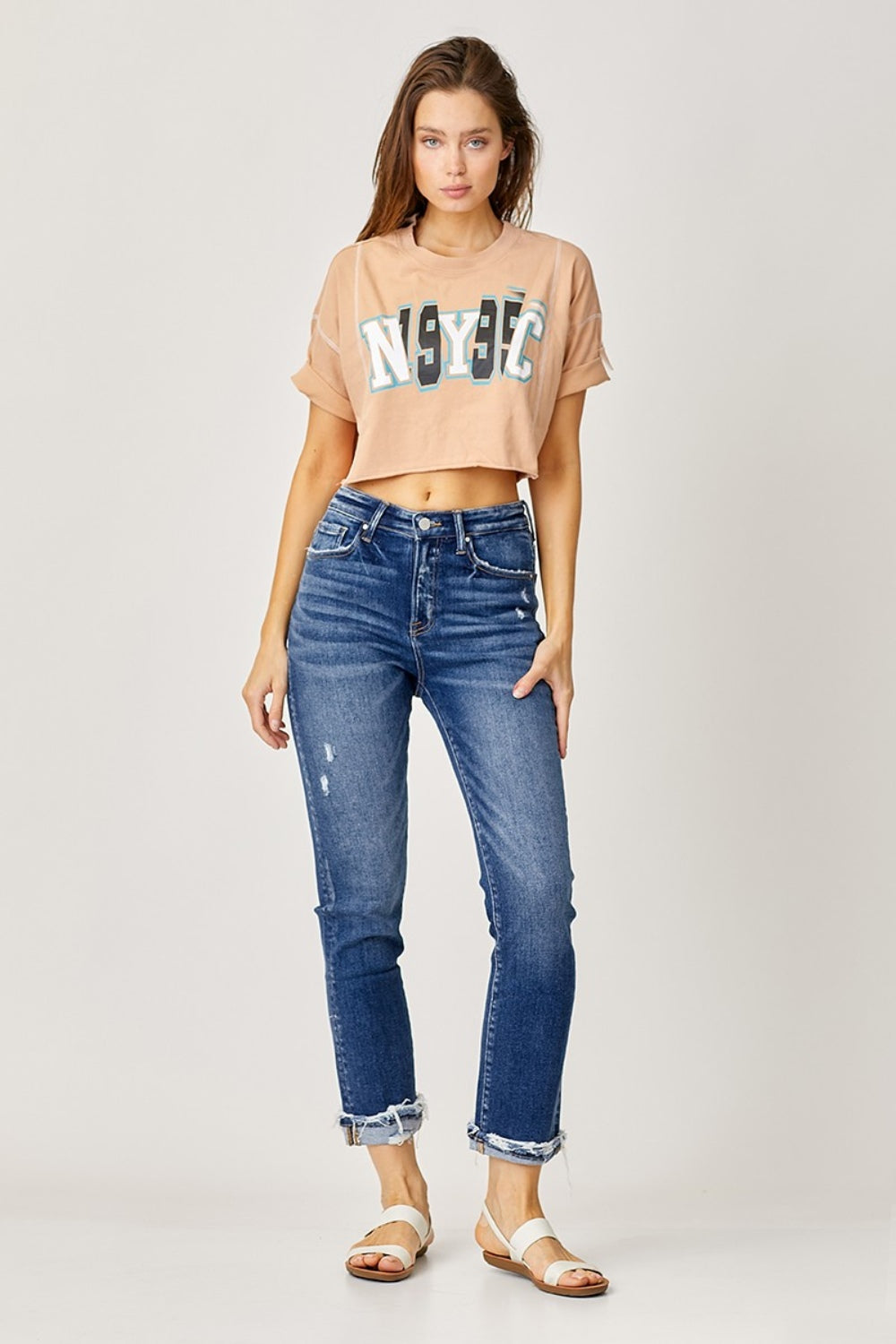 Dark-wash straight jeans with edgy frayed hem and rolled cuffs
