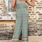 Casual floral print jumpsuit with elastic waist and flowy design.