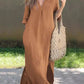Brown V-neck maxi dress with a loose, flowy fit.