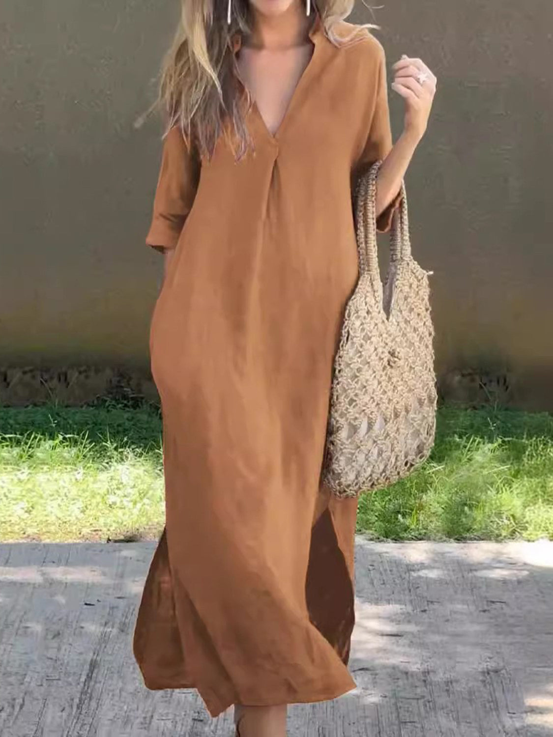 Brown V-neck maxi dress with a loose, flowy fit.