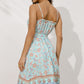 Lightweight Boho Chic Midi Dress with delicate floral pattern.