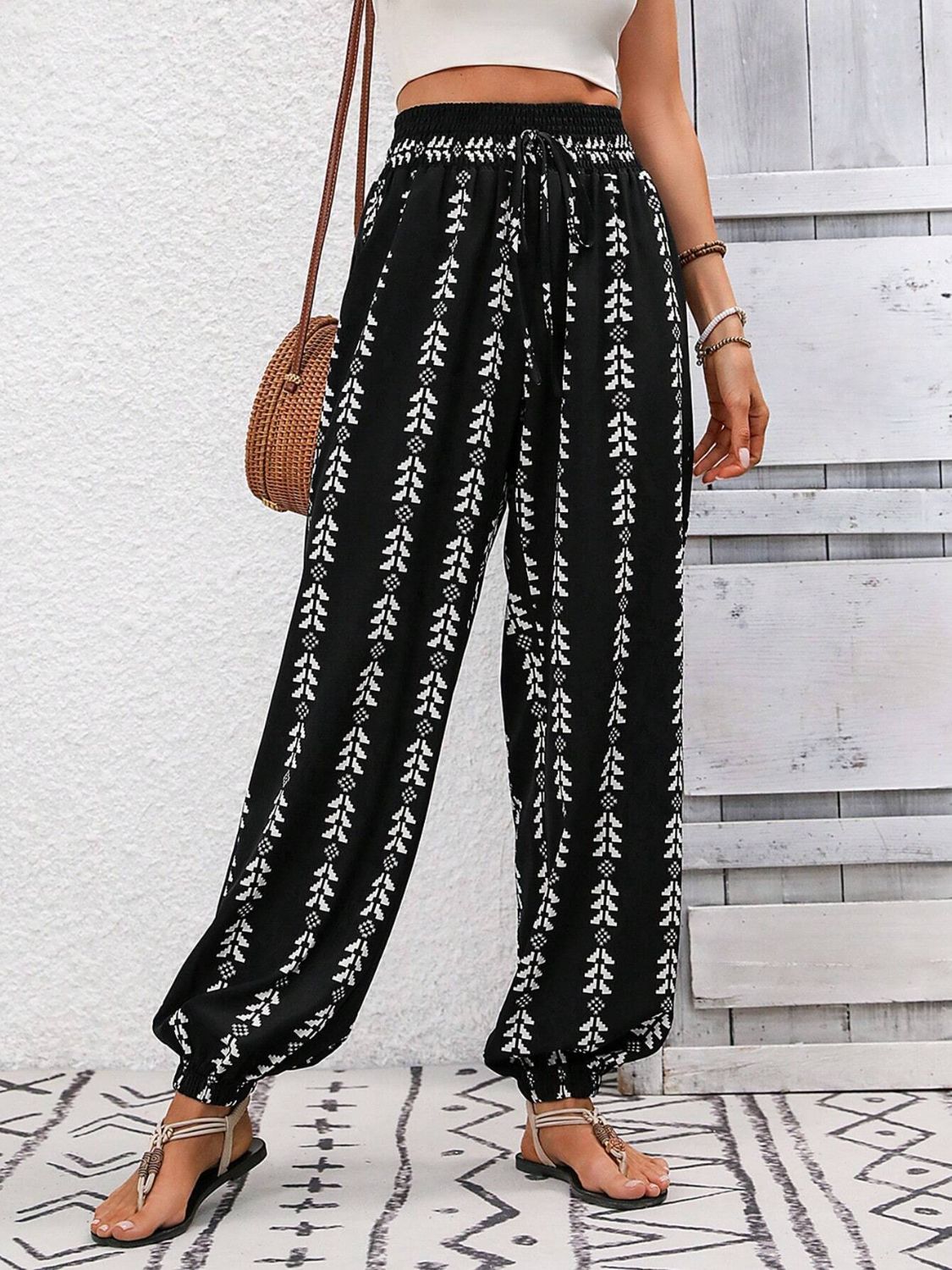 Comfortable black pants with elastic waistband and bohemian design