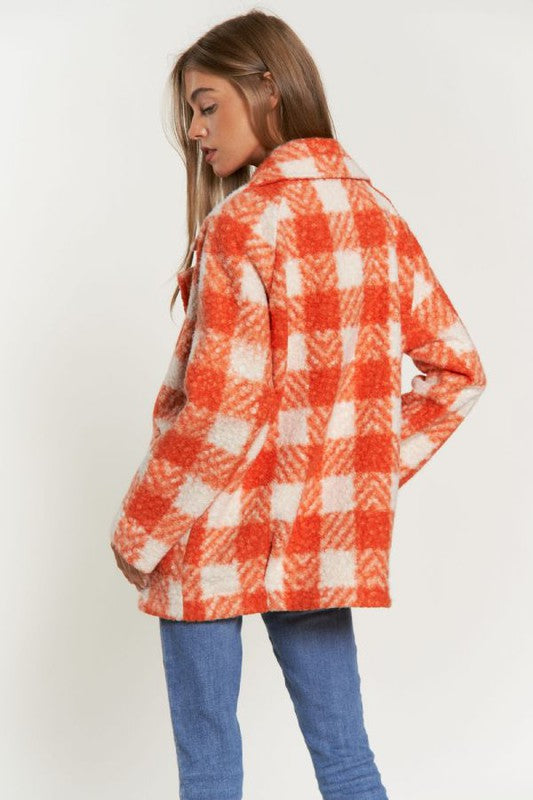 Chic boucle plaid coat for women, featuring side pockets and a lapel neck.
