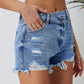 Chic distressed denim shorts with a raw hem, perfect for summer. Versatile, comfortable, and effortlessly stylish for any casual occasion.