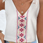 Lightweight white tank top featuring intricate embroidery down the front