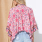 Lightweight kimono with pink floral pattern.
