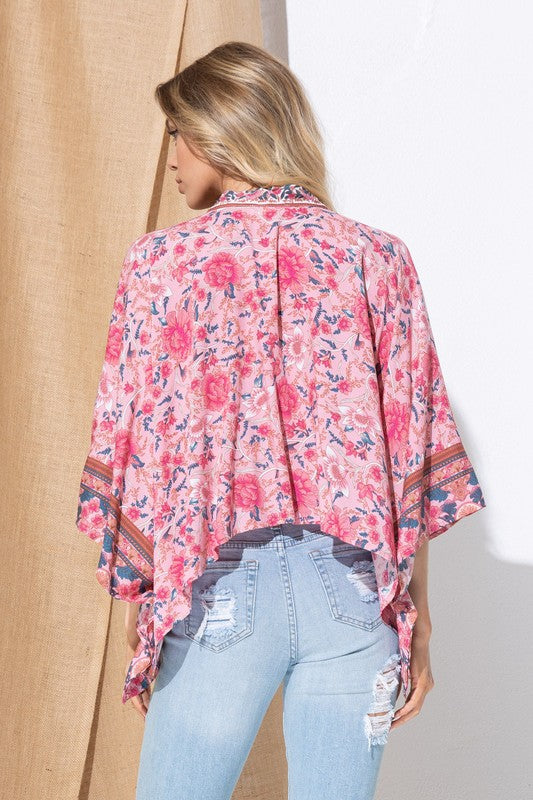 Lightweight kimono with pink floral pattern.