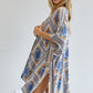 Geometric print kimono with playful tassels, available in yellow and blue