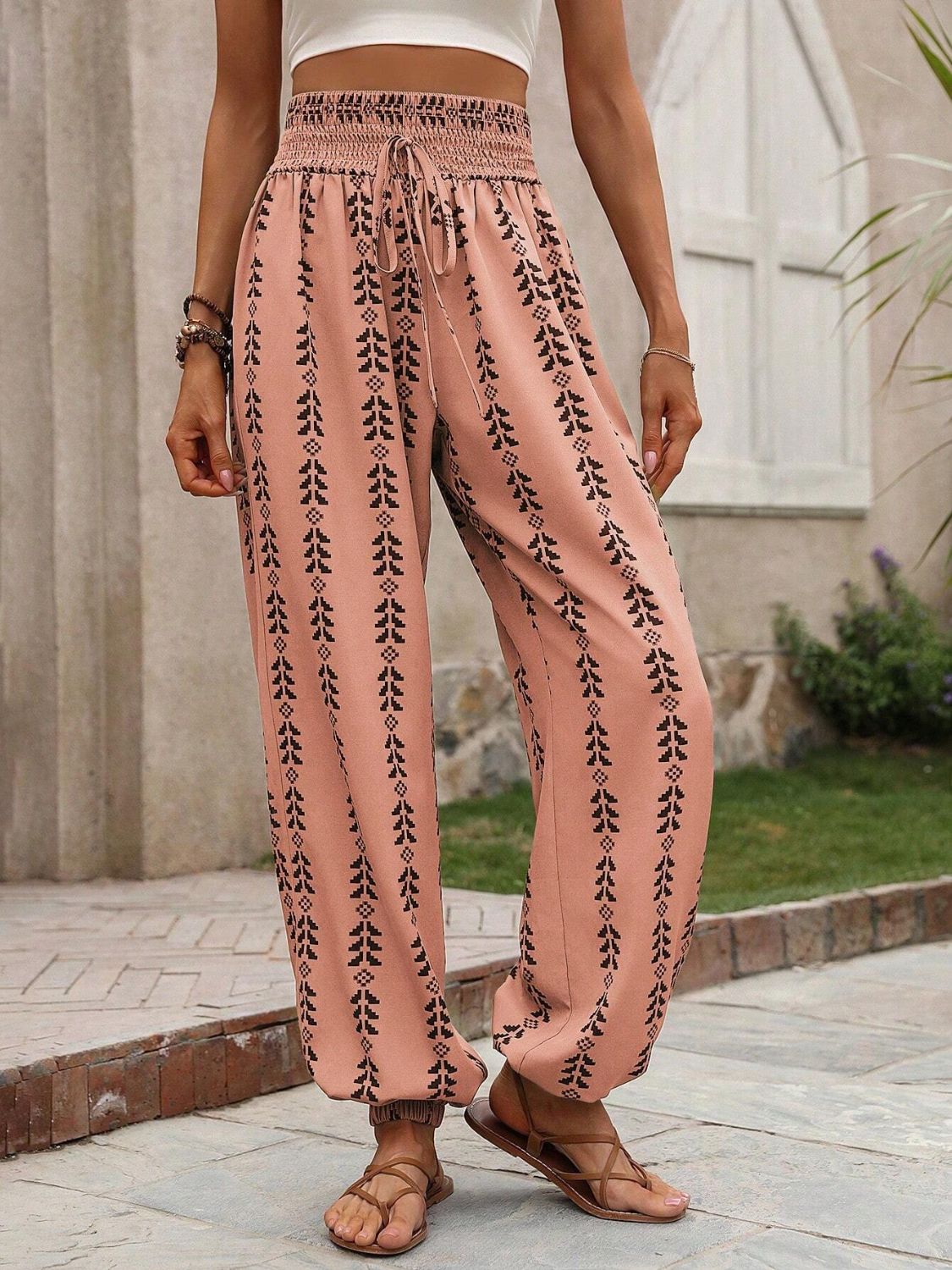 Pink boho chic drawstring pants with intricate pattern