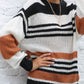 Fall fashion: striped chunky knit sweater styled with distressed jeans