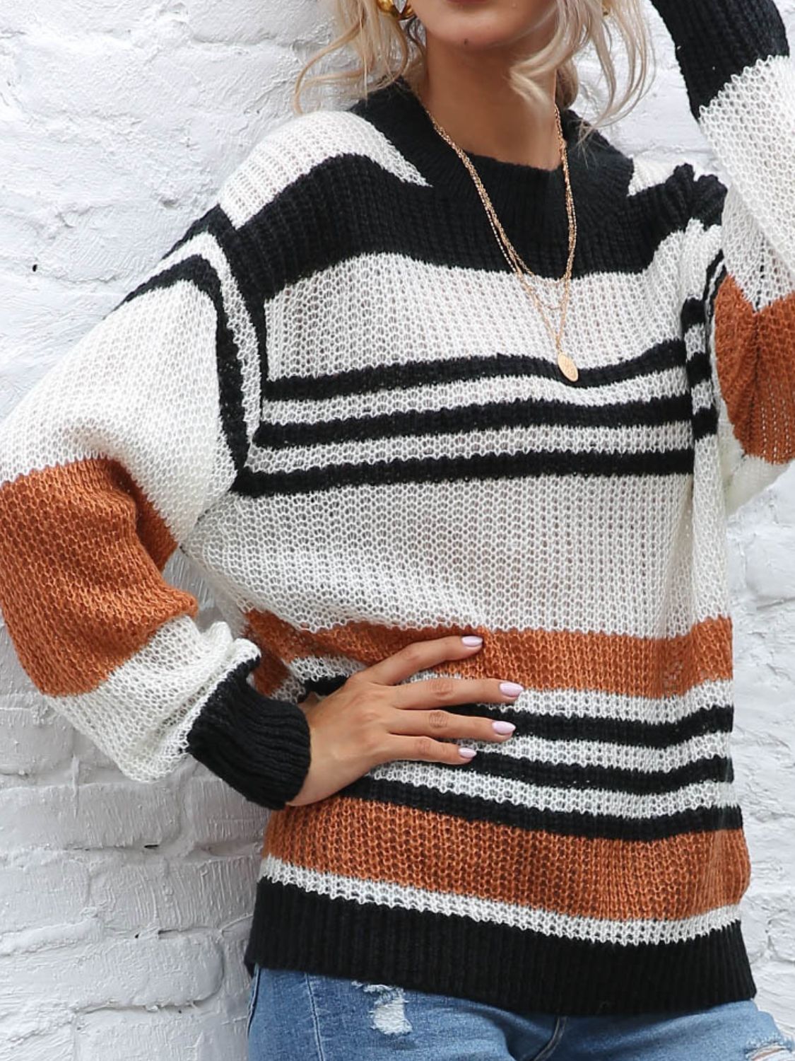 Fall fashion: striped chunky knit sweater styled with distressed jeans