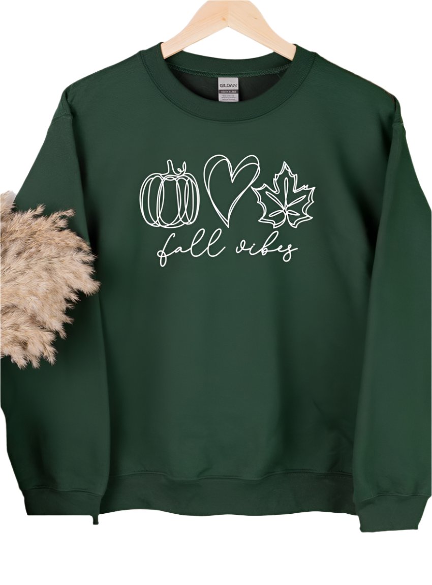 Forest green fall vibes sweatshirt with pumpkin, heart, and leaf graphic on the front.
