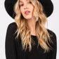 Fashionable fuzzy fedora for winter outfits
